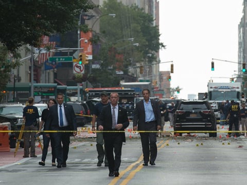 New York Governor Andrew Cuomo (R) visits the scene of an explosion on West 23rd Street Sept. 18, 2016 in New York. An explosion rocked one of the most fashionable neighborhoods of New York, injuring 29 people.